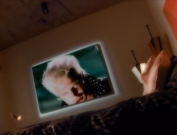 Movie still from “Billy Idol - Cradle Of Love” (1990), directed by David Fincher – Extreme Close Up shot, High angle