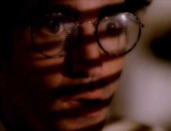 Movie still from “Billy Idol - Cradle Of Love” (1990), directed by David Fincher – Extreme Close Up shot, High angle