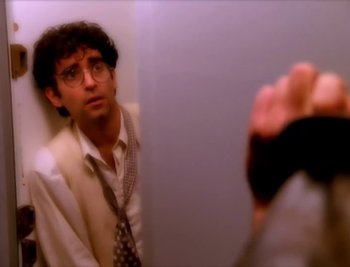 Movie still from “Billy Idol - Cradle Of Love” (1990), directed by David Fincher – Medium shot, Over the shoulder angle