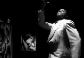 Movie still from “Madonna - Vogue” (1990), directed by David Fincher – Extreme Close Up shot, Low angle