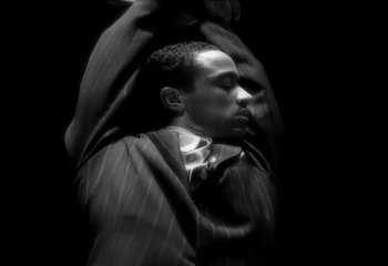 Movie still from “Madonna - Vogue” (1990), directed by David Fincher – Extreme Close Up shot, Low angle