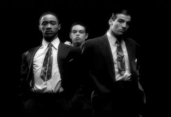 Movie still from “Madonna - Vogue” (1990), directed by David Fincher – Medium shot, Low angle