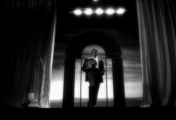 Movie still from “Madonna - Vogue” (1990), directed by David Fincher – Wide shot, Low angle