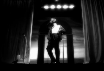 Movie still from “Madonna - Vogue” (1990), directed by David Fincher – Medium shot, Low angle