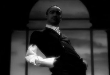 Movie still from “Madonna - Vogue” (1990), directed by David Fincher – Medium shot, Low angle