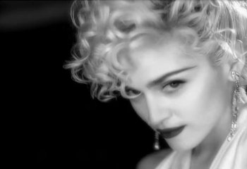Movie still from “Madonna - Vogue” (1990), directed by David Fincher – Close Up shot, Low angle