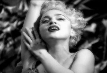 Movie still from “Madonna - Vogue” (1990), directed by David Fincher – Extreme Close Up shot, Low angle