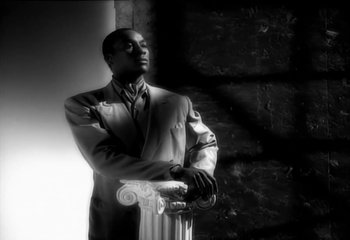 Movie still from “Madonna - Vogue” (1990), directed by David Fincher – Medium shot, Low angle