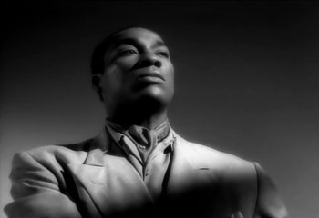 Movie still from “Madonna - Vogue” (1990), directed by David Fincher – Close Up shot, Low angle