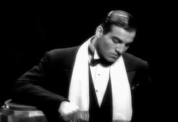 Movie still from “Madonna - Vogue” (1990), directed by David Fincher – Medium shot, Low angle