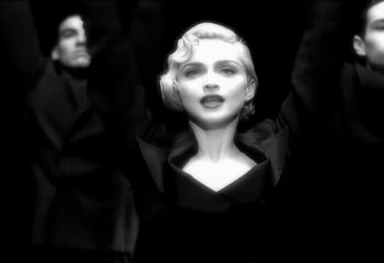 Movie still from “Madonna - Vogue” (1990), directed by David Fincher – Close Up shot, Low angle