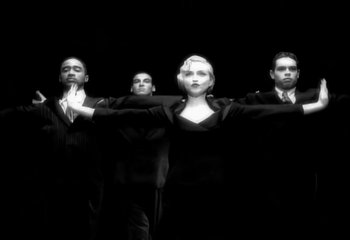 Movie still from “Madonna - Vogue” (1990), directed by David Fincher – Medium shot, Low angle