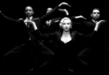 Movie still from “Madonna - Vogue” (1990), directed by David Fincher – Medium shot, Low angle