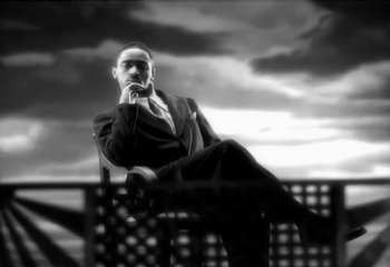 Movie still from “Madonna - Vogue” (1990), directed by David Fincher – Medium shot, Low angle