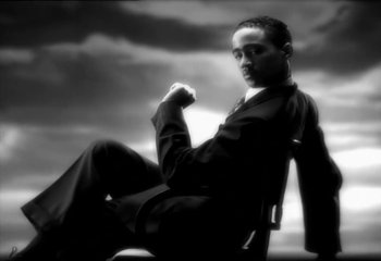 Movie still from “Madonna - Vogue” (1990), directed by David Fincher – Medium shot, Low angle