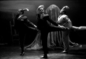 Movie still from “Madonna - Vogue” (1990), directed by David Fincher – Wide shot, Low angle