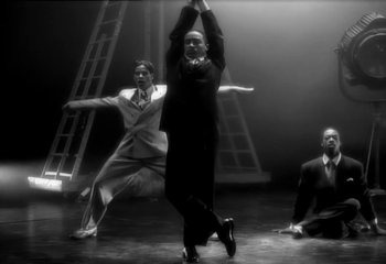 Movie still from “Madonna - Vogue” (1990), directed by David Fincher – Wide shot, Low angle