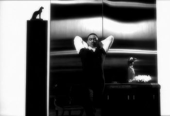 Movie still from “Madonna - Vogue” (1990), directed by David Fincher – Medium shot, Low angle