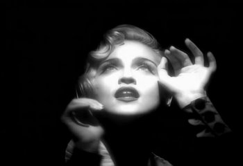 Movie still from “Madonna - Vogue” (1990), directed by David Fincher – Close Up shot, Overhead angle