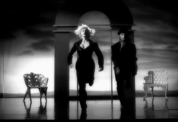 Movie still from “Madonna - Vogue” (1990), directed by David Fincher – Wide shot, Low angle