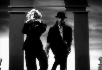 Movie still from “Madonna - Vogue” (1990), directed by David Fincher – Medium shot, Low angle