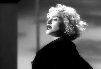 Movie still from “Madonna - Vogue” (1990), directed by David Fincher – Close Up shot, Low angle