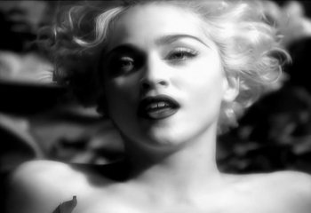 Movie still from “Madonna - Vogue” (1990), directed by David Fincher – Extreme Close Up shot, Low angle
