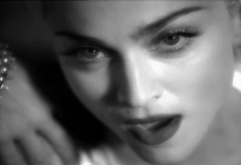 Movie still from “Madonna - Vogue” (1990), directed by David Fincher – Extreme Close Up shot, Low angle