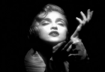 Movie still from “Madonna - Vogue” (1990), directed by David Fincher – Close Up shot, Low angle
