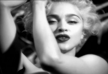 Movie still from “Madonna - Vogue” (1990), directed by David Fincher – Extreme Close Up shot, Low angle