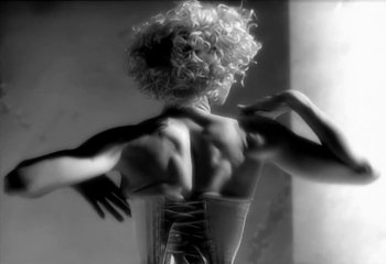 Movie still from “Madonna - Vogue” (1990), directed by David Fincher – Extreme Close Up shot, Low angle
