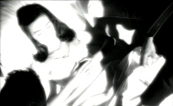 Movie still from “Madonna - Oh Father” (1989), directed by David Fincher – Extreme Close Up shot, High angle