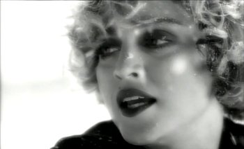 Movie still from “Madonna - Oh Father” (1989), directed by David Fincher – Extreme Close Up shot, Low angle