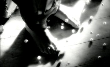 Movie still from “Madonna - Oh Father” (1989), directed by David Fincher – Extreme Close Up shot, Low angle