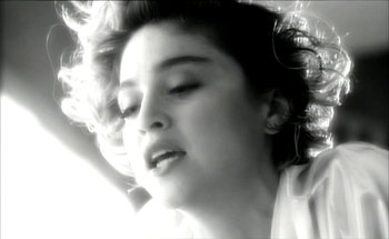 Movie still from “Madonna - Oh Father” (1989), directed by David Fincher – Close Up shot, Low angle