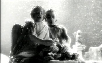 Movie still from “Madonna - Oh Father” (1989), directed by David Fincher – Extreme Close Up shot, Low angle