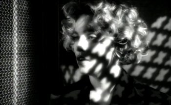 Movie still from “Madonna - Oh Father” (1989), directed by David Fincher – Extreme Close Up shot, High angle