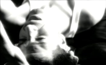 Movie still from “Madonna - Oh Father” (1989), directed by David Fincher – Extreme Close Up shot, Overhead angle