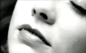 Movie still from “Madonna - Oh Father” (1989), directed by David Fincher – Extreme Close Up shot, Low angle