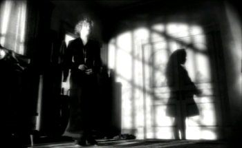 Movie still from “Madonna - Oh Father” (1989), directed by David Fincher – Wide shot, Low angle