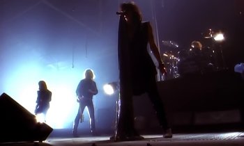 Movie still from “Aerosmith - Janie’s Got A Gun” (1989), directed by David Fincher – Wide shot, Low angle