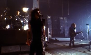 Movie still from “Aerosmith - Janie’s Got A Gun” (1989), directed by David Fincher – Wide shot, Low angle
