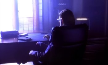 Movie still from “Aerosmith - Janie’s Got A Gun” (1989), directed by David Fincher – Medium shot, High angle