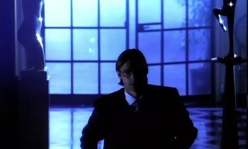 Movie still from “Aerosmith - Janie’s Got A Gun” (1989), directed by David Fincher – Medium shot, Low angle