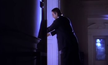 Movie still from “Aerosmith - Janie’s Got A Gun” (1989), directed by David Fincher – Medium shot, Low angle