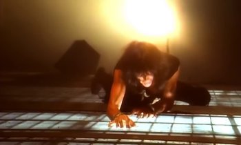 Movie still from “Aerosmith - Janie’s Got A Gun” (1989), directed by David Fincher – Medium shot, High angle