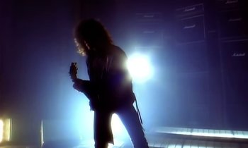 Movie still from “Aerosmith - Janie’s Got A Gun” (1989), directed by David Fincher – Medium shot, Low angle