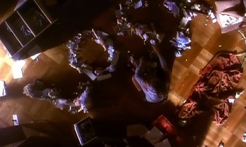 Movie still from “Aerosmith - Janie’s Got A Gun” (1989), directed by David Fincher – Extreme Wide shot, Overhead angle