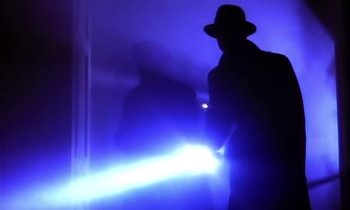 Movie still from “Aerosmith - Janie’s Got A Gun” (1989), directed by David Fincher – Medium shot, Low angle