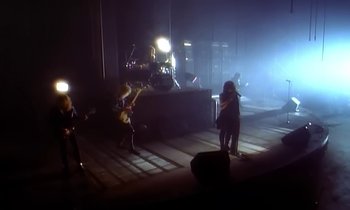 Movie still from “Aerosmith - Janie’s Got A Gun” (1989), directed by David Fincher – Wide shot, High angle